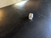 E95 Step 2-4 01 Required Spacer (24) found on floor, from rod end of left lower handle bar arm.jpg