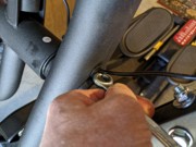 E95 Step 3-2 06 Use the round end of a wrench to force the grommet into the hole in the mast.jpg