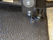E95 Step 4-08 03 Install left bracket (25), angled to rear, with stubby machine screws (145).jpg