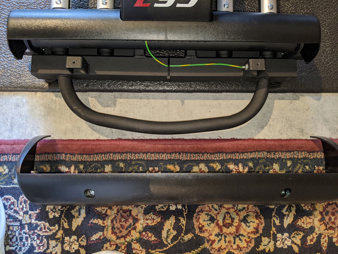 E95 Step 4-09 02 Rear Stabilizer cover with screws inserted, opposite raised mounting holes.jpg