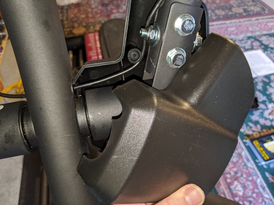 E95 Step 4-10 04 Fit front cover to handle bar; note cutout for wire at grommet.jpg