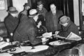1934-03-15 Chief County Detective, Harry B Crook, talking to reporters in Spring Lake police station.jpg
