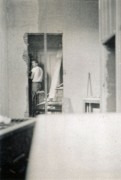 1947-07 1 Pete stripping 5 coats of wallpaper off bedroom wall - I'm standing in kitchen ell, of living room.jpg