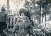 1952-12 1 Dan in Davy Crockett coonskin cap, with Pete Jr on leaf pile.jpg