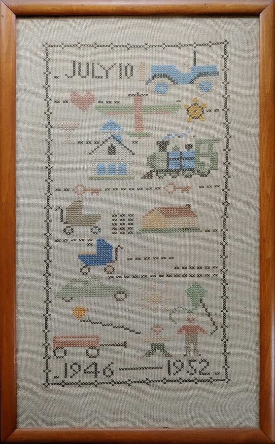1952-12~ 2 Diane's cross-stitch sampler, now with Morgan.jpg