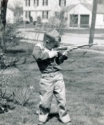 1955-05-03 1 Dan's birthday outfit, new rifle & early daffodil.jpg