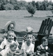 1957-05-27 3 (left) Pete Jr holding Andrea & Dan; (center) Carl behind John; (right) Judy; Memorial Day, Perry home, Sudbury MA.jpg
