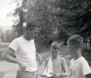 1960-08 25 Pete Sr explains a catamaran to Dan & John, Weare NH.jpg
