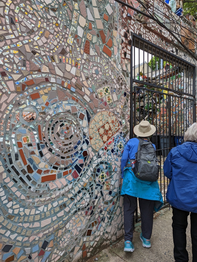 2023-05-09 183 Karen peeks into Magic Garden,  Isaiah Zagar Mosaics, South Street, Philadelphia.jpg